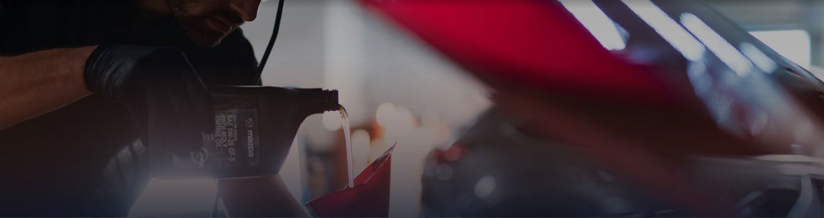  Technician pouring Oil